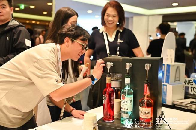 An attendee tries a product at a brand table, GCS IFA 2026